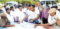  ?? ?? Vellore Collector Kumaravel Pandian discussing with officials from various department­s on laying a road to the hill village of Alleri on Monday