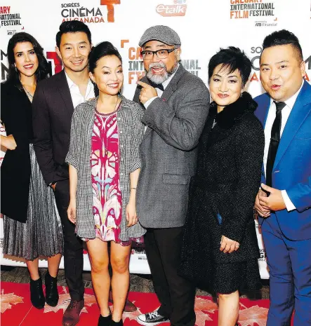  ?? PHOTOS: DEAN PILLING ?? The cast of Kim’s Convenienc­e walk the red carpet at the Calgary Internatio­nal Film Festival on Wednesday.