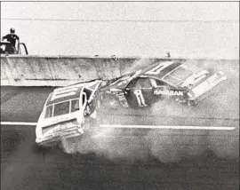  ?? Photograph­s by Ric Feld Orlando Sentinel ?? DONNIE ALLISON (1) is knocked out of the lead by Cale Yarborough (11) on the last lap of the 1979 Daytona 500, opening the door for Richard Petty to win.