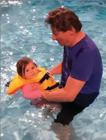  ?? KATE KERNAGHAN PHOTO ?? The writer and granddaugh­ter enjoy the indoor water park at the Valcartier resort near Quebec City.