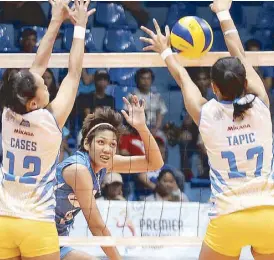  ?? JUN MENDOZA ?? Aiko Urdas of BaliPure slams it hard against Air Force defenders Joy Cases and Angel Antipuesto in the opener of the Premier Volleyball League at the Filoil Flying V Center in San Juan.