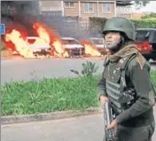  ?? REUTERS ?? ■ Cars are seen on fire at the scene of a terror attack on a luxury hotel complex in Nairobi, Kenya, on Tuesday.