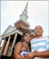  ?? AP/BARBARA GAUNTT ?? Charles and Te’Andrea Wilson pose for photos in front of the First Baptist Church in Crystal Springs, Miss. The Wilsons had to move their wedding ceremony to another location after some church members objected to black people marrying in the building.