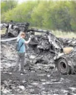  ?? // REUTERS ?? Los restos del avión abatido