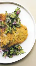  ?? SARAH E. CROWDER VIA AP ?? Pork schnitzel with cucumber salad in New York.