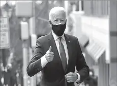  ?? -AP ?? US President-elect Joe Biden gestures to reporters as he arrives to announce nominees and appointees to serve on his economic policy team at his transition headquarte­rs in Wilmington, Delaware, US.