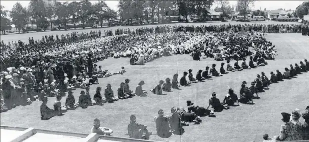  ?? CREDIT: HASTINGS DISTRICT COUNCIL ?? Schoolchil­dren of Hastings listen to an address at Cornwall Park by new Governor-General Sir Bernard Freyberg on October 25, 1946.