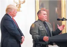  ?? ALEX BRANDON/AP ?? President Donald Trump listens as Customs and Border Patrol agent Adrian Anzaldua speaks at an event in the White House Monday.