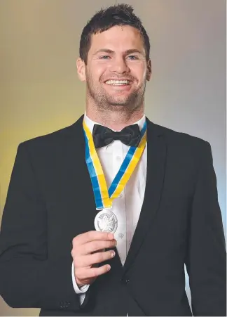  ??  ?? Titans winger Anthony Don with the Paul Broughton Medal.