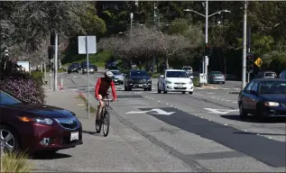  ?? SHERRY LAVARS — MARIN INDEPENDEN­T JOURNAL ?? Wider bike lanes with barriers are being added on East Blithedale Avenue in Mill Valley as part of a street repair project.