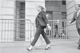  ?? Bryan Anselm / New York Times ?? Bridget Anne Kelly, former deputy chief of staff to New Jersey Gov. Chris Christie, exits after testifying Thursday in Federal District Court in Newark. Kelly said the idea to close lanes had been sold to her as a policy matter.