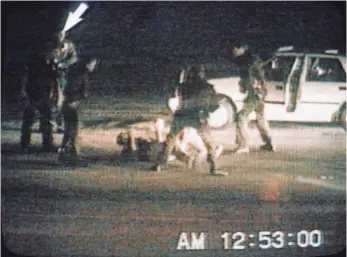  ?? 1991 PHOTO BY AFP/GETTY IMAGES ?? The acquittal of the officers caught on tape beating Rodney King sparked the Los Angeles riots in 1992. “We had been sitting on a powder keg for years,” ex-Dodgers outfielder Eric Davis says.