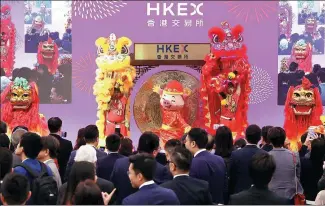  ?? XINHUA ?? The Hong Kong bourse holds a reopening ceremony on Feb 8, the first trading day after the Lunar New Year.