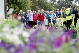  ?? PHOTO: JOHN-KIRK ANDERSON/STUFF ?? Green-fingered punters wait for the gates to open at the Ellerslie Flower Show in 2014. The $3m festival was scrapped after losing $700,000 over five events.