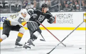  ?? Ringo H.W. Chiu The Associated Press ?? Golden Knights forward Jonas Rondbjerg, left, and Los Angeles Kings forward Blake Lizotte chase the puck during the second period Thursday in Los Angeles.