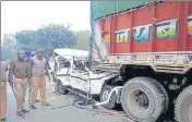  ??  ?? Mangled remains of the vehicle after it collided with a truck on the Prayagraj-Lucknow highway, in Pratapgarh on Friday.