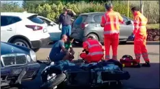  ??  ?? Ambulance personnel tend to a man lying on the ground, later identified as actor George Clooney, after being involved in a scooter accident in the near Olbia, on the Sardinia island, Italy, on Tuesday.
AP PHOTO/MARIO CHIROnI