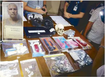  ??  ?? Police officers present the items seized from Robin Hoyt Alderman (inset) during a press conference at Camp Crame yesterday.