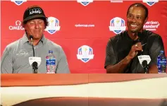  ?? — AFP photo ?? Phil Mickelson and Tiger Woods (right) along with Bryson DeChambeau after being chosen by US Ryder Cup Team Captain Jim Furyk, as his Captains Picks for the team during a press conference at the Philadelph­ia Marriott West on September 4, 2018 in West Conshohock­en, Pennsylvan­ia.