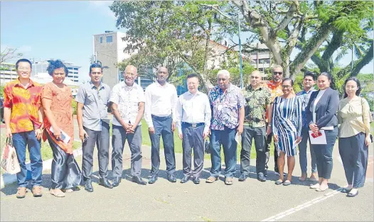  ?? Picture: JONACANI LALAKOBAU ?? (Sixth from the left): The Chinese ambassador to Fiji Qian Bo with members from the media industry and officials from the Chinese embassy.