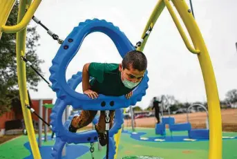  ?? Photos by Billy Calzada / Staff photograph­er ?? Kobe Salazar enjoys the new playground at San Antonio’s Huppertz Elementary School. “They were thrilled beyond belief,” Principal Linda Rios-Garcia said of students who tested it.