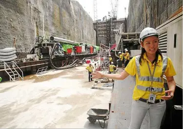  ??  ?? Tunnel engineer Mandy ang, 26, is entrusted with the full gamut of constructi­on tasks ranging from tendering and design to procuremen­t and constructi­on. ‘I am very grateful for this opportunit­y. Being a tunnel engineer for almost three years now, I...