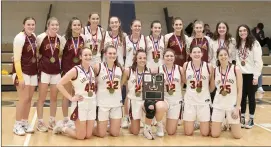  ?? Photo by Becky Polaski ?? Members of the Elk County Catholic Lady Crusaders are shown with their District 9 1A girls’ championsh­ip plaque and medals following their 42-20 win over Ridgway on Saturday. Pictured, in front, from left, are Gracee Breindel, Tori Newton, Sami Straub, Lucy Klawuhn, Emily Mourer, and Sydney Alexander; and in back, Arianna Gurosik, Bailey Thorwart, Katie Straub, Lena Polaski, Payton Newton, Gina Geci, Mya Pistner, Sofiya Cherry, Rachael VanSlander, Maggie Toncich, and Gerrianne Vogt.