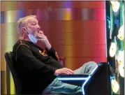  ?? ASSOCIATED PRESS FILE PHOTO ?? A man smokes while playing a slot machine at the Ocean Casino Resort in Atlantic City, N.J., on Feb. 10.