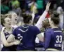  ?? AP PHOTO/RON SCHWANE ?? Notre Dame’s Arike Ogunbowale, second from right, is congratula­ted by teammates after making the game-winning basket to defeat Connecticu­t in overtime in the semifinals of the women’s NCAA Final Four college basketball tournament Friday in Columbus,...