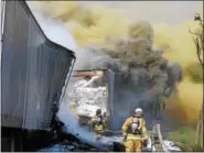  ?? SUBMITTED PHOTO - DAVID REIMER SR. ?? Firefighte­rs respond to two tractor trailer trucks that caught fire on eastbound Interstate 78 in Greenwich Township on Friday, May 19.