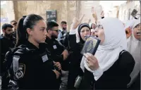  ?? PICTURE: EPA ?? Palestinia­n worshipper­s confront Israeli police as they come to pray yesterday in the old city of Jerusalem but refuse to pass through new security measures imposed by Israel at the entrance to the Al-Aqsa mosque.