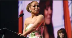  ?? AP PHOTO/CHRIS PIZZELLO ?? Jennifer Lopez accepts the spotlight actress award for her role in “Hustlers” at the 31st annual Palm Springs Internatio­nal Film Festival Awards Gala on Thursday in Palm Springs, Calif.