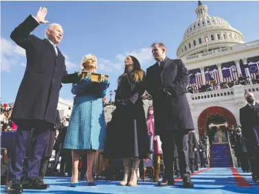  ?? ANDREW HARNIK/POOL VIA REUTERS ?? Joe Biden is sworn in as the 46th president of the United States by Chief Justice John Roberts as Jill Biden holds the Bible during the presidenti­al inaugurati­on at the U.S. Capitol in Washington, D.C., Wednesday.