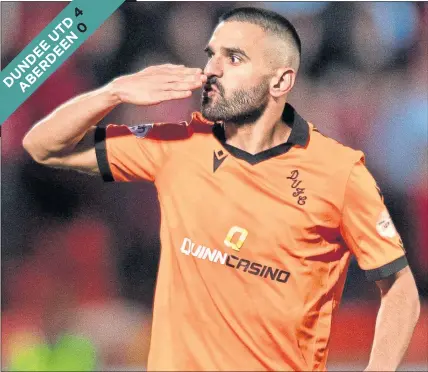  ?? ?? Dundee United’s Aziz Behich celebrates opening the scoring at Tannadice last night