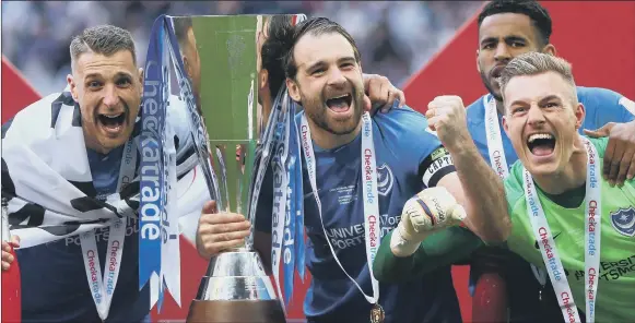  ?? Picture: Jordan Mansfield/Getty Images ?? TIME TO CELEBRATE
Pompey celebrate their 2019 Checkatrad­e Trophy final win against Sunderland at Wembley