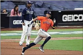  ?? JAE C. HONG / AP ?? The Astros’ Carlos Correa runs to second after hitting a double against the Rays during the seventh inning in Game 6 of the MLB American League Championsh­ip Series on Friday in San Diego.