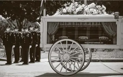  ?? Marie D. De Jesús / Staff photograph­er ?? The casket of Army Spc. Vanessa Guillén arrives at Cesar Chavez High School on Aug. 14 in Houston, where the slain soldier was a student. Fort Hood, where she was stationed and believed killed, is planning on naming a gate at the post in honor of her.