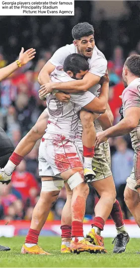  ?? ?? Georgia players celebrate their famous win at the Principali­ty Stadium
Picture: Huw Evans Agency