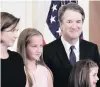  ?? PHOTO: TNS ?? Judge Brett Kavanaugh stands with his family in the East Room of the White House yesterday as he is announced as Supreme Court nominee to replace the retiring Justice Anthony M. Kennedy.