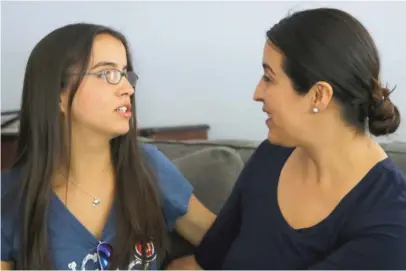  ?? TIM BOYLE/SUN-TIMES ?? Dorelia Rivera (right) and her daughter Kayla Martinez at their Elmwood Park home. “I just grabbed her arm,” Rivera said. “She’s, like, ‘Mom, you’re hurting me!’ I said, ‘You’re not staying on this plane!’ ”