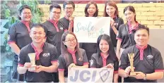  ??  ?? The Smile for Peace Organising Committee (standing, from left) 2018 JCI Tanjung Aru Immediate Past President Lenny Yap, Dr Jeremy Tong, YC Yang, Amanda Yong, Tiffany Chin and Giselle Hiew. Seated, from left: Ball Lee, organising chairperso­n Guah Chin...