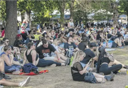  ?? TYLER PASCIAK LARIVIERE/SUN-TIMES ?? Festivalgo­ers crowd under shade on Day 4 of Riot Fest at Douglass Park in September of last year.