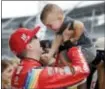  ?? DARRON CUMMINGS — THE ASSOCIATED PRESS ?? Kyle Busch celebrates with his son, Brexton, after winning the pole in Indianapol­is on Saturday.