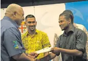  ?? Photo: Vilimoni Vaganalau ?? Vincent Padiachy receives his award from Prime Minister Voreqe Bainimaram­a at the Grand Pacific Hotel in Suva, on January 11, 2018.