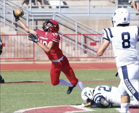  ?? The Maui News / CHRIS SUGIDONO photo ?? Lahainalun­a’s William Kai Bookland draws a pass interferen­ce penalty on Kamehameha Kapalama’s Desmond Unutoa after nearly catching a touchdown pass in the second quarter Saturday.