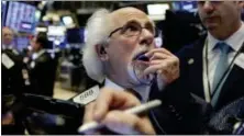  ?? RICHARD DREW — THE ASSOCIATED PRESS ?? Trader Peter Tuchman works on the floor of the New York Stock Exchange, Tuesday.