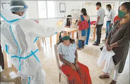  ?? ANUPAM NATH/AP ?? A girl in India is tested Monday for COVID-19. India ranks second in the world with over 7.5 million confirmed cases.