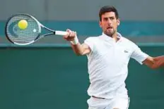  ?? Reuters ?? Serbian former world No. 1 Novak Djokovic powers a forehand shot during the action at Wimbledon.