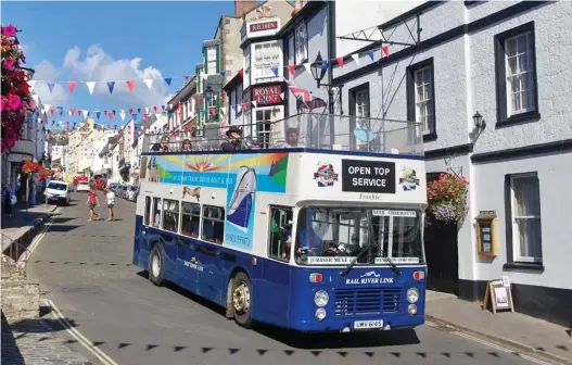  ??  ?? Not fare: Tours in the Mendip Mule open-topped bus, pictured in Lyme Regis, upset locals in nearby retirement flats