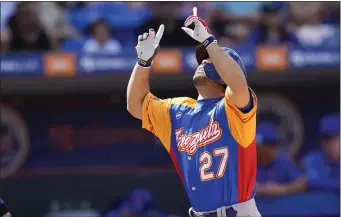  ?? LYNNE SLADKY — THE ASSOCIATED PRESS ?? Venezuela’s Jose Altuve (27) crosses the plate to score on a solo home run during the second inning of an exhibition baseball game against the New York Mets, Thursday, March 9, 2023, in Port St. Lucie, Fla.